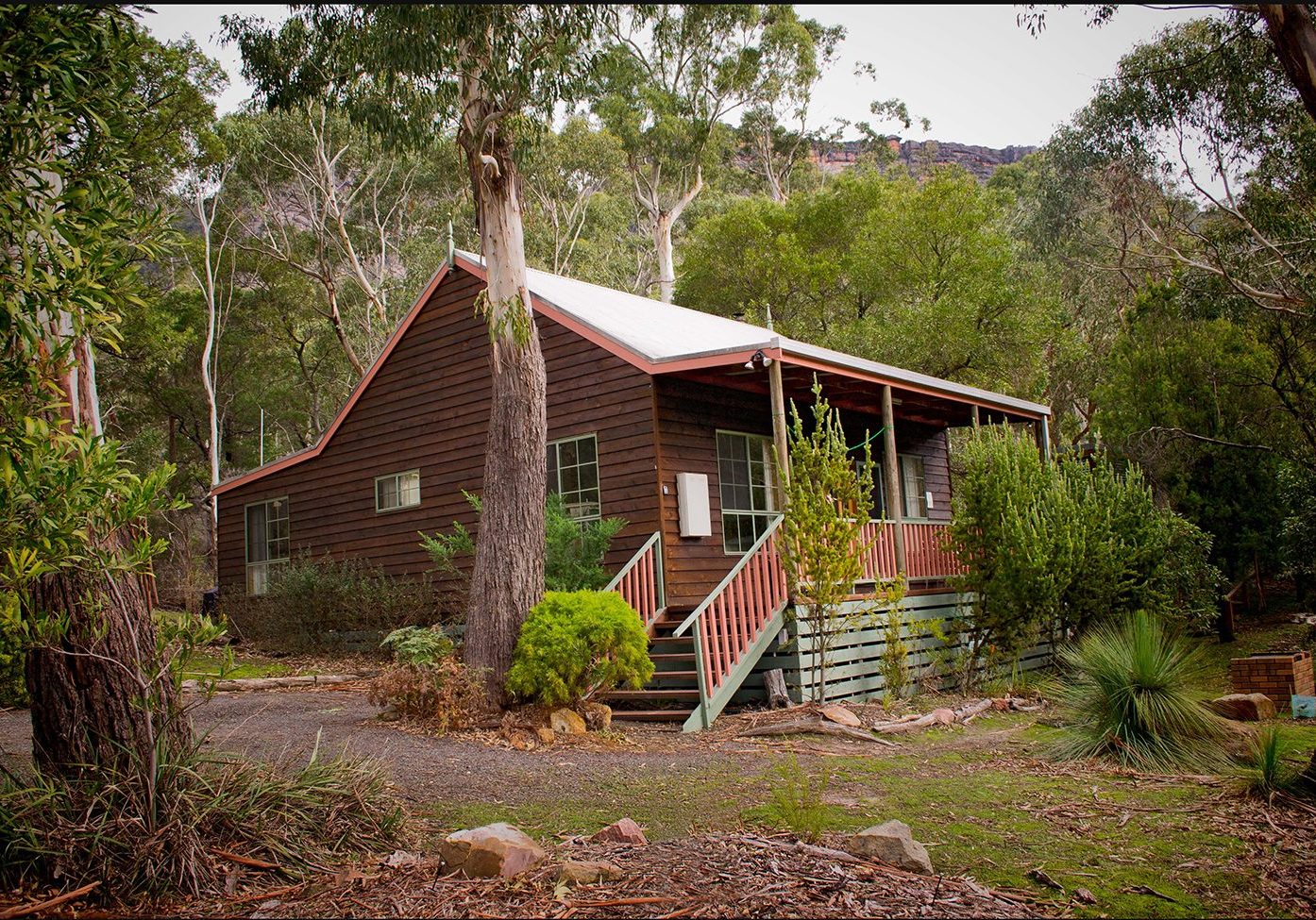 Country lane front of cottage with Serra mountain range at top of photograph